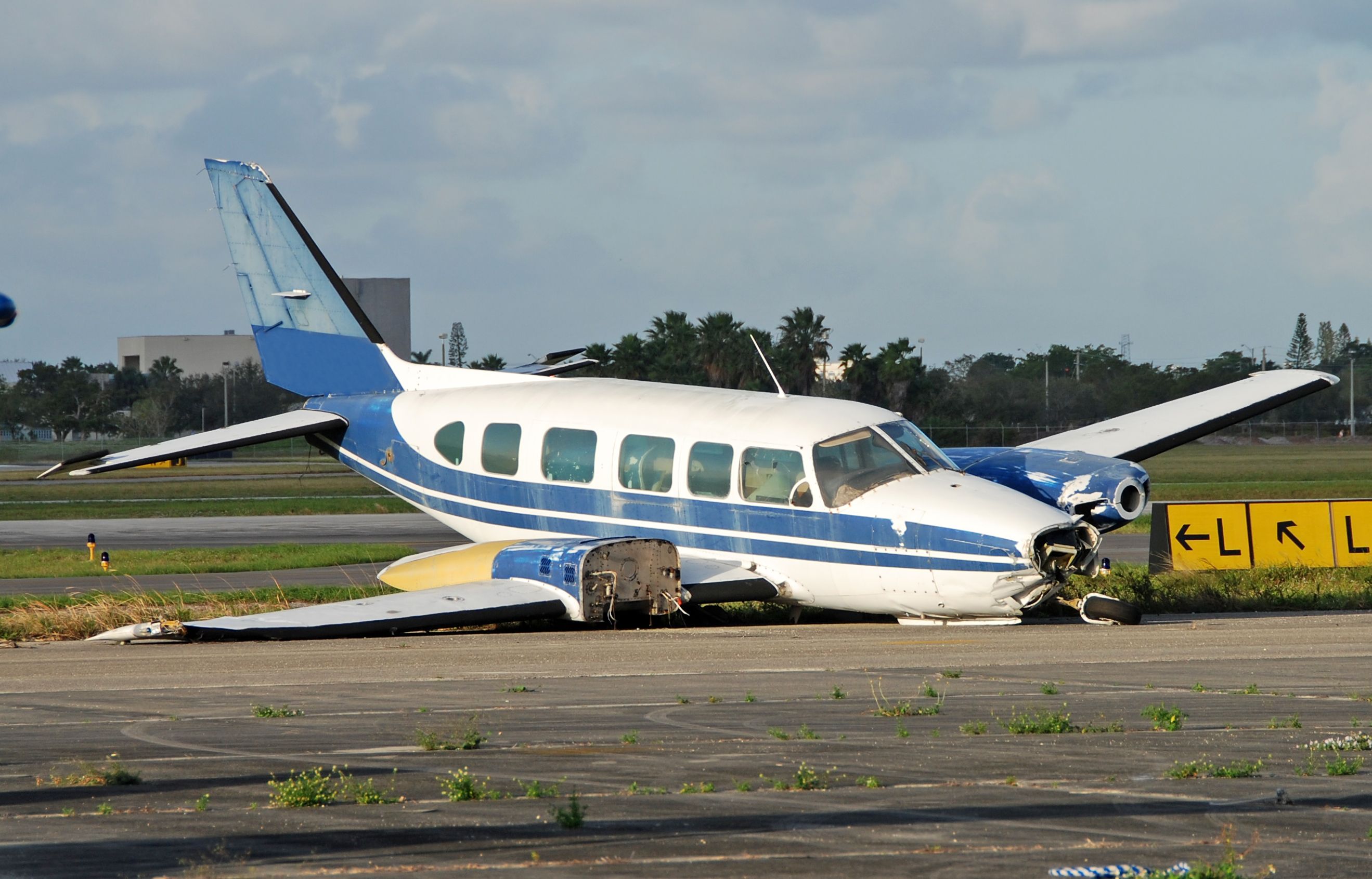 Aircraft resting on forward side after crash