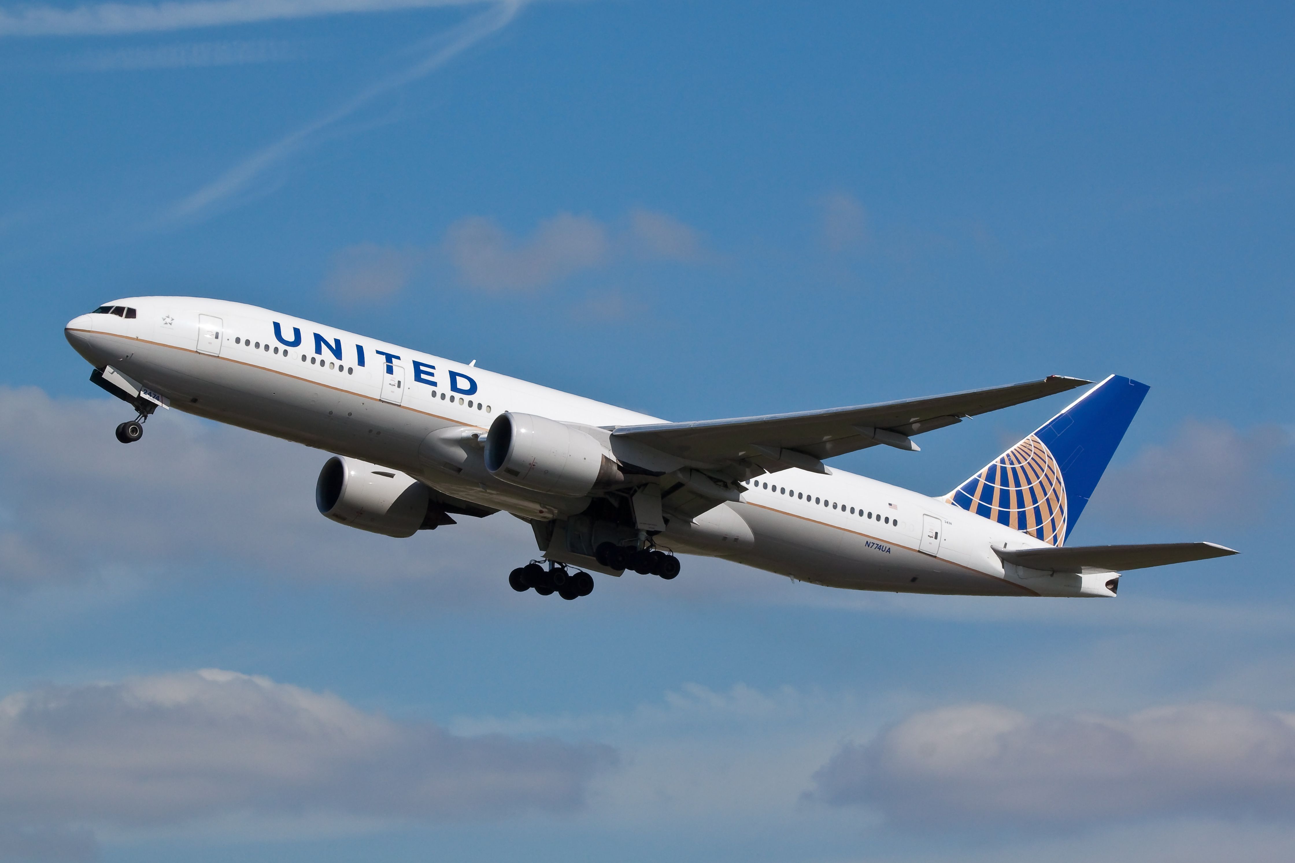 United Airlines Boeing 777-200 departing LHR shutterstock_187642739