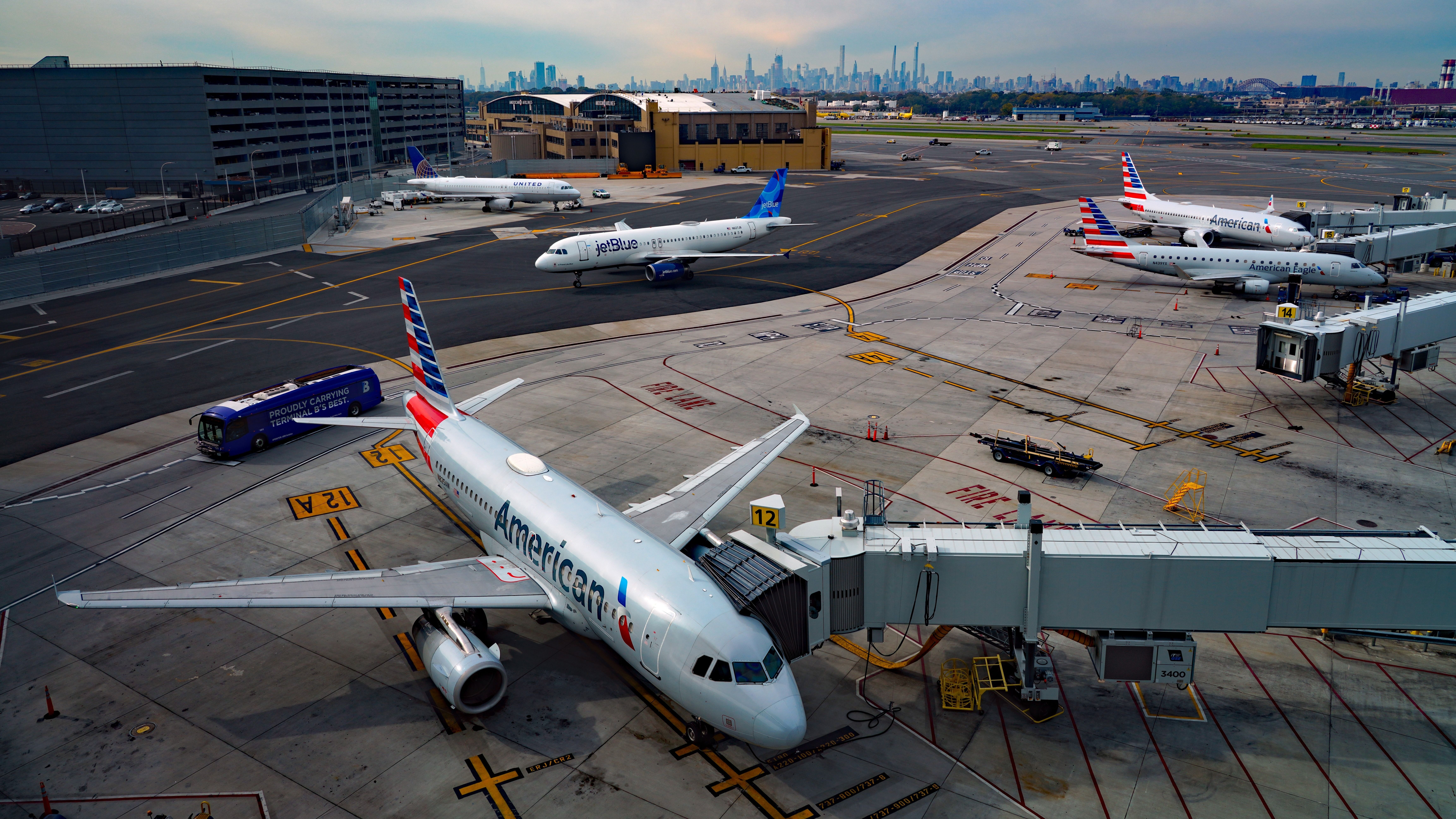 US Airlines and Jetblue aircraft in LGA Shutterstock_2407069165