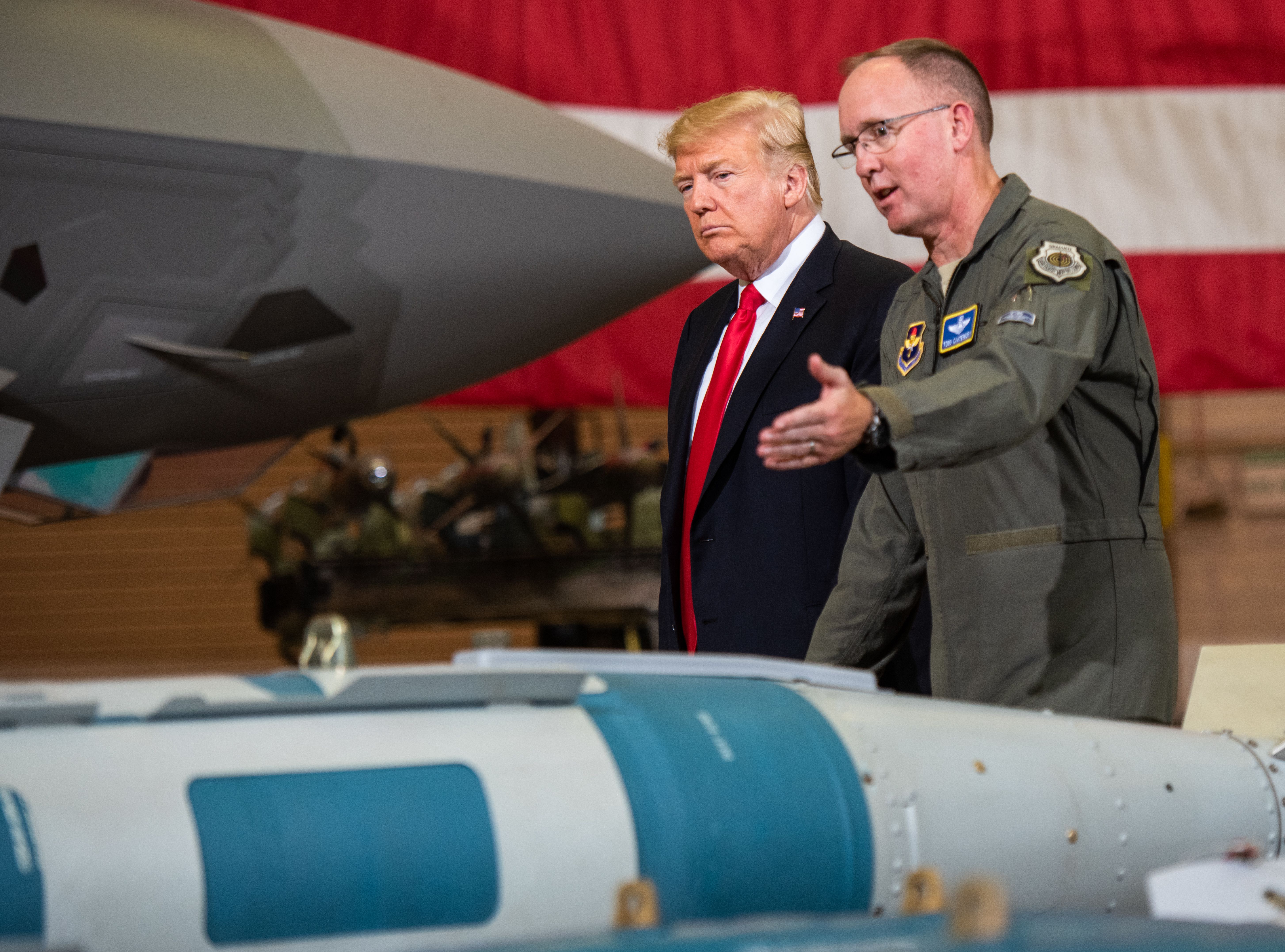 Brig Gen. Todd Canterbury, 56th Fighter Wing commander briefs President Donald J. Trump about a GB-12 bomb during his visit to Luke Air Force Base, Ariz., Oct. 19, 2018