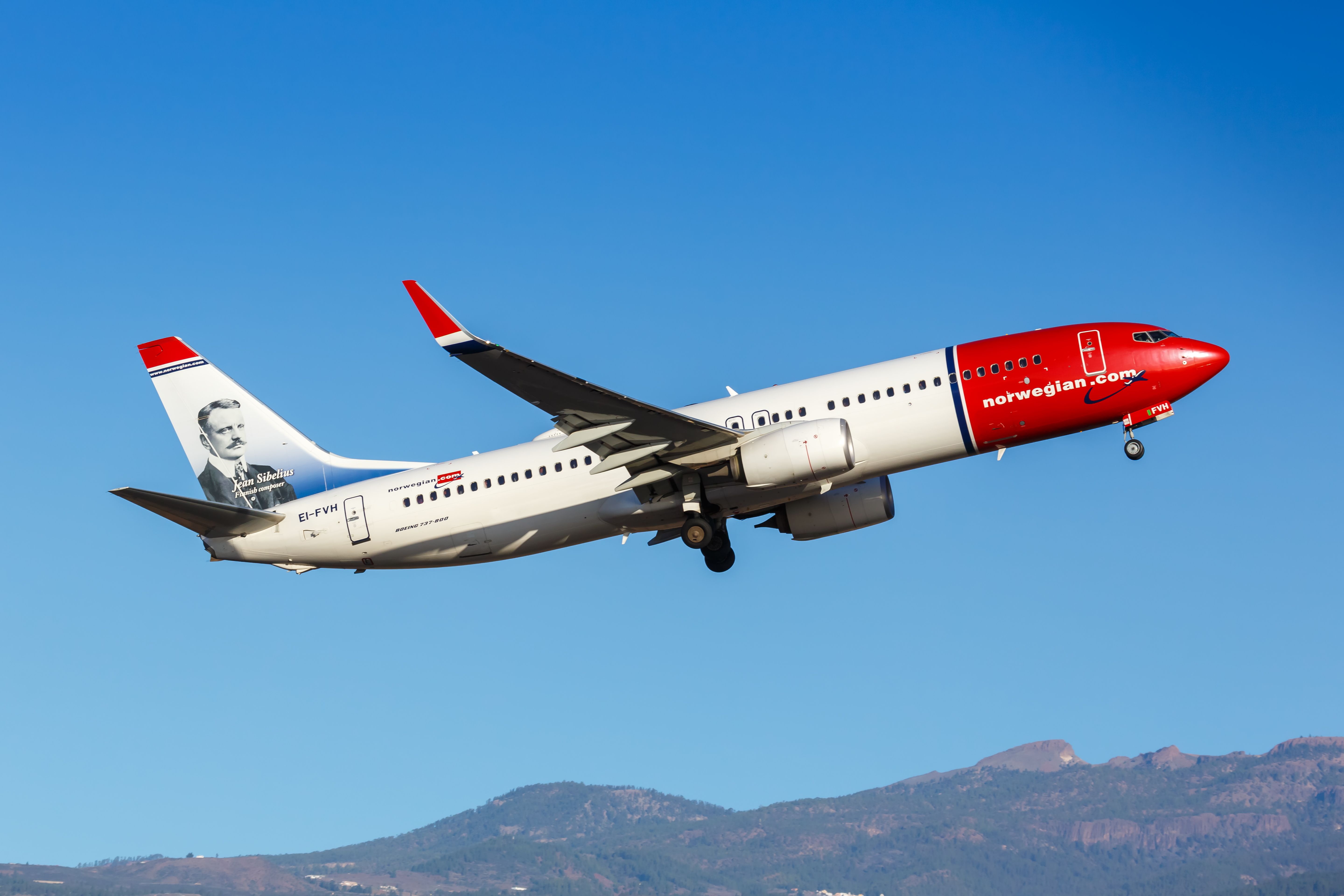 Norwegian Boeing 737-800 departing Tenerife South Airport TFS shutterstock_1859310016