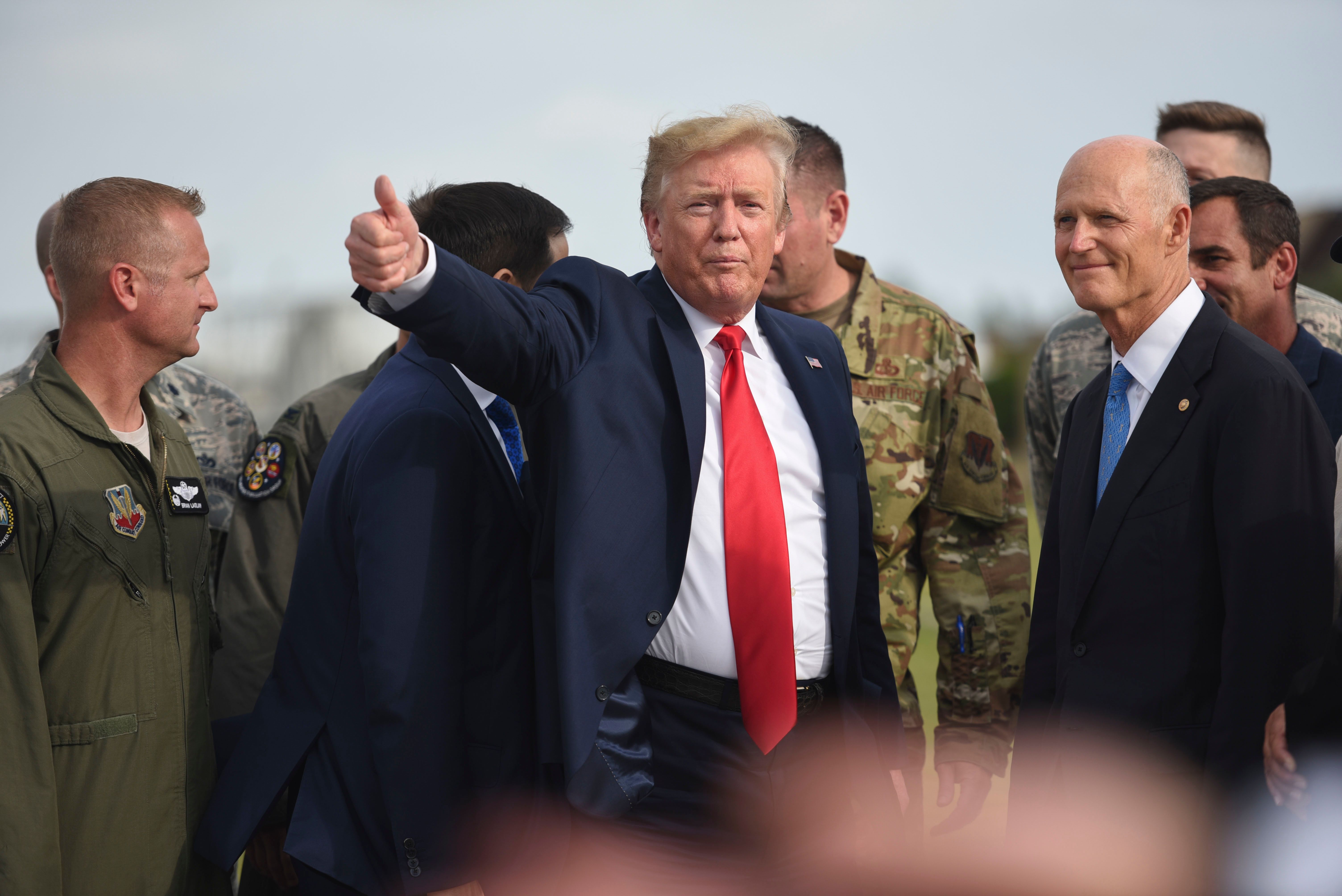 President Donald J. Trump speaks with military and civic leaders during a flightline tour at Tyndall Air Force Base, Florida, May 8, 2019
