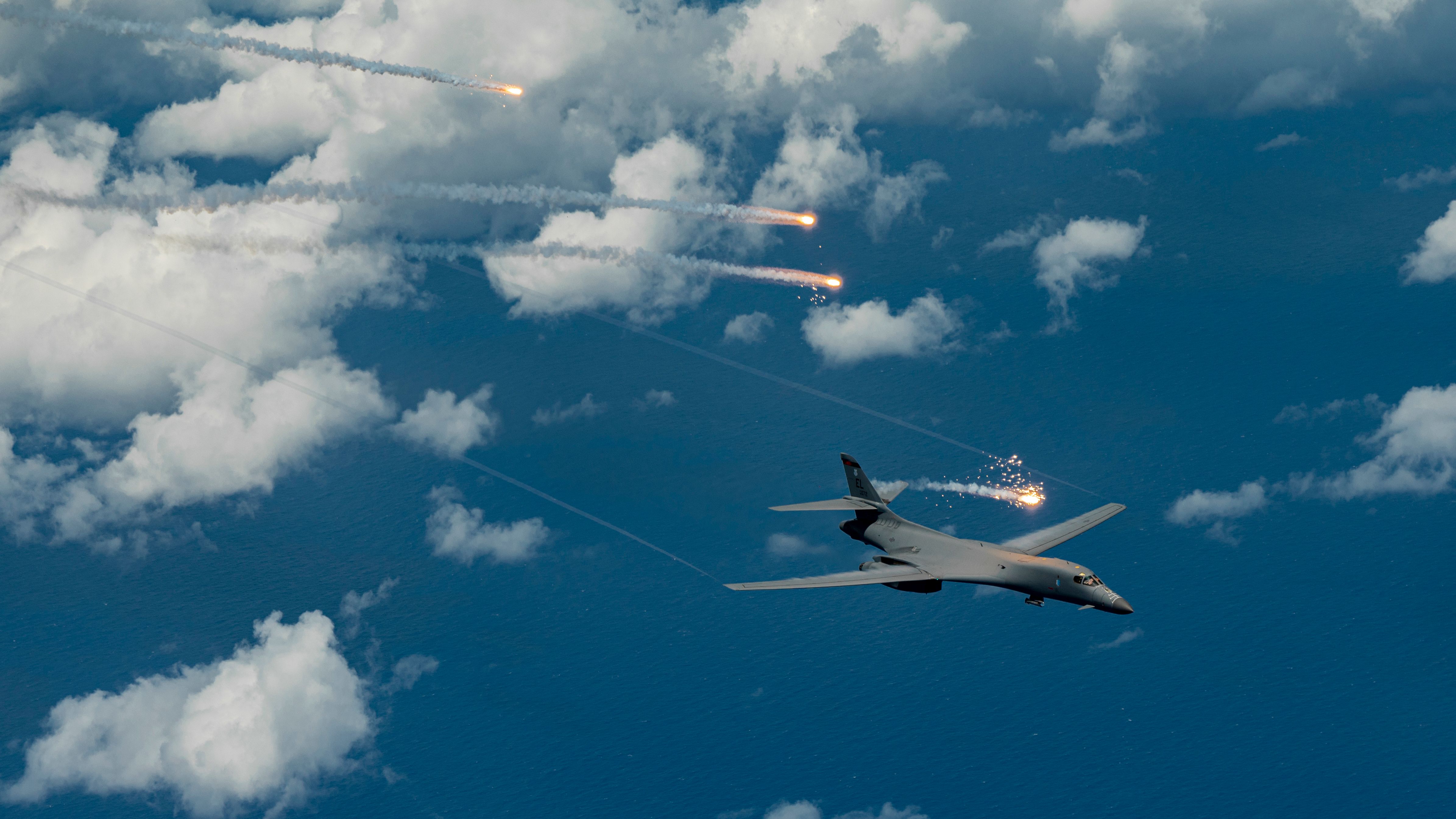 A U.S. Air Force B-1B Lancer, assigned to 34th Expeditionary Bomb Squadron, deploys flares during a Bomber Task Force mission over the Pacific Ocean, June 25, 2022