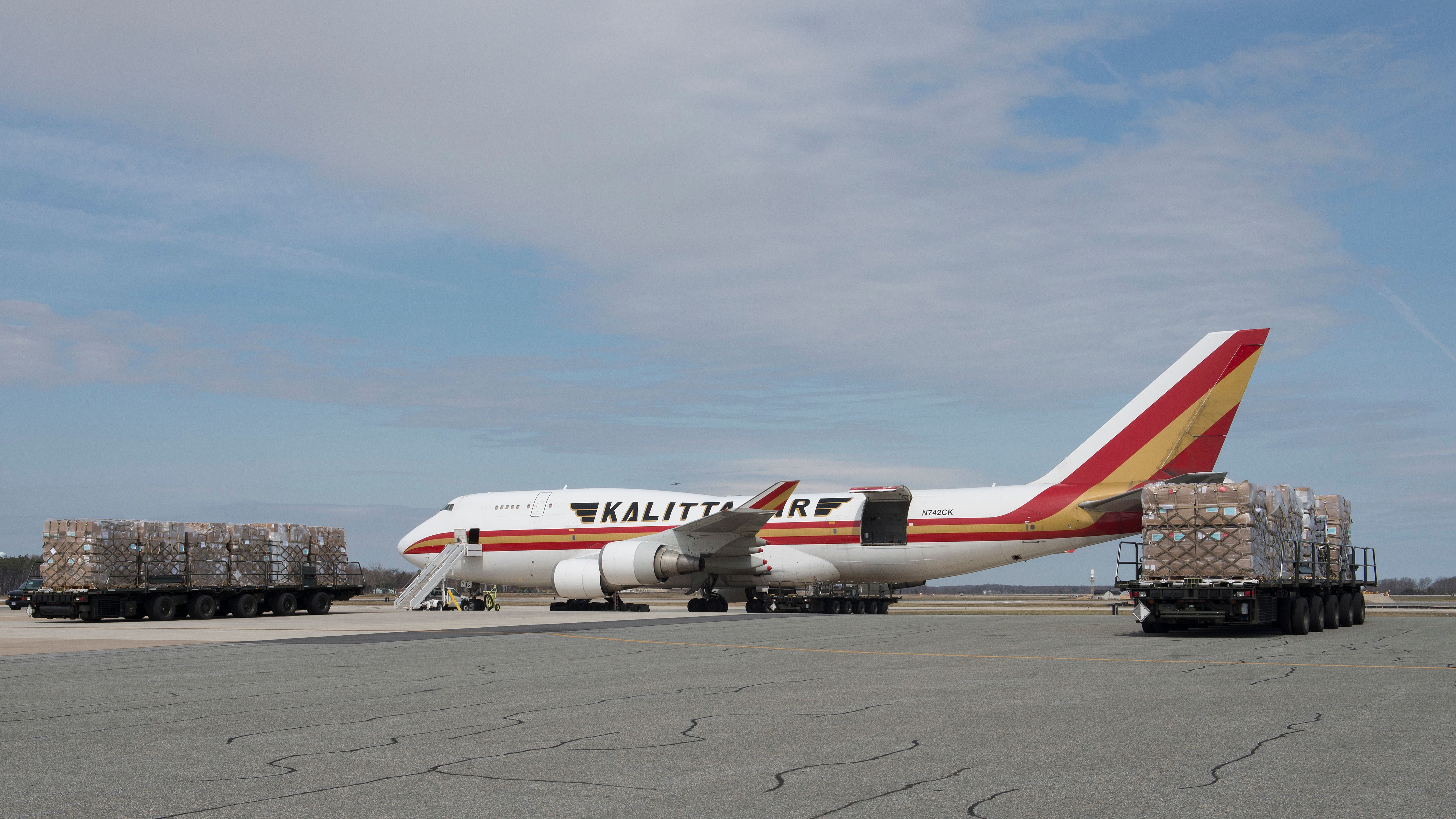 K-Loaders carrying cargo pallets preposition prior to an upload of a Kalitta Air Boeing 747 cargo plane March 24, 2017, at Dover Air Force Base, Del.