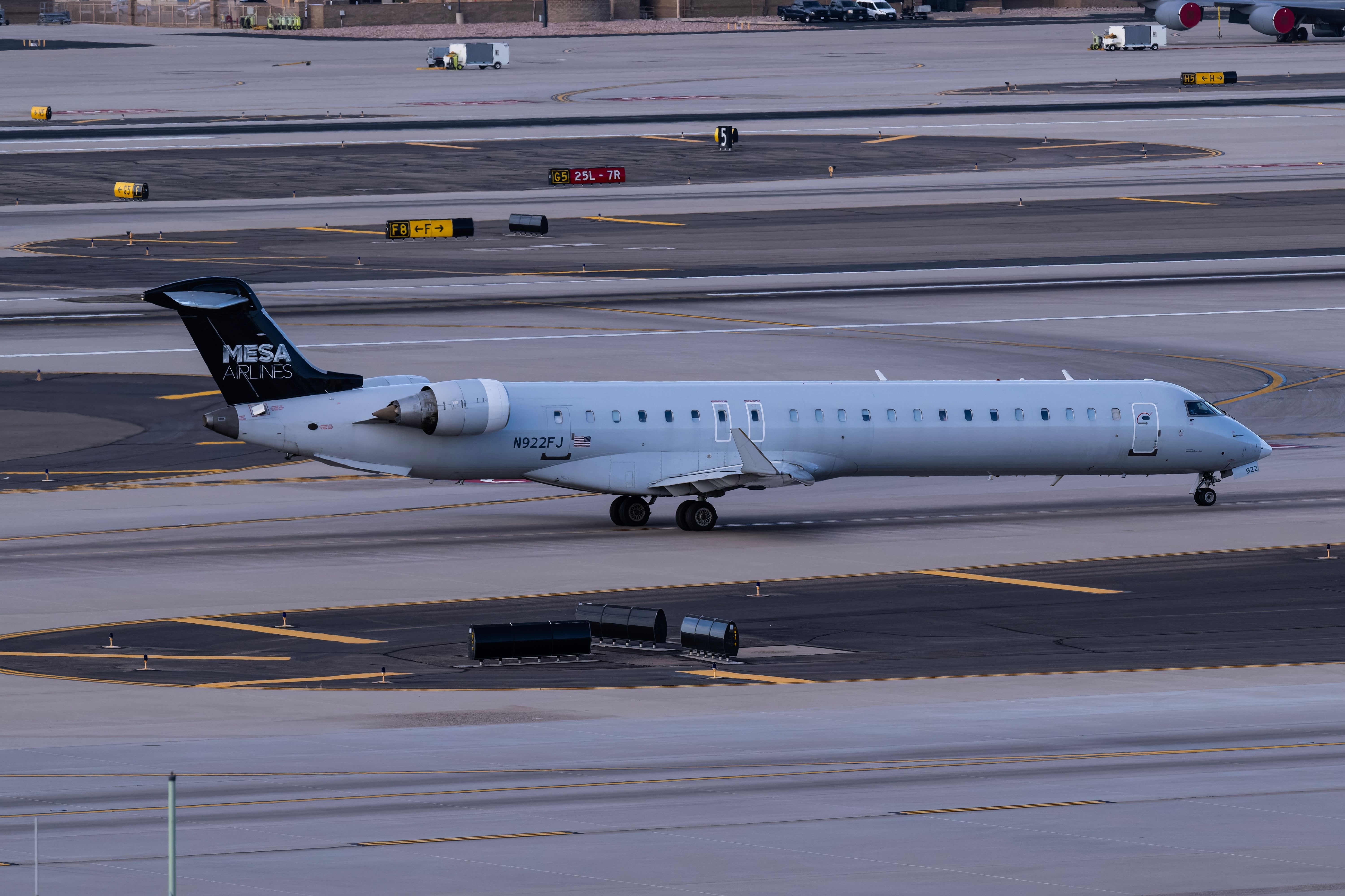 Mesa Airlines Mitsubishi CRJ900 departing PHX shutterstock_2475482697