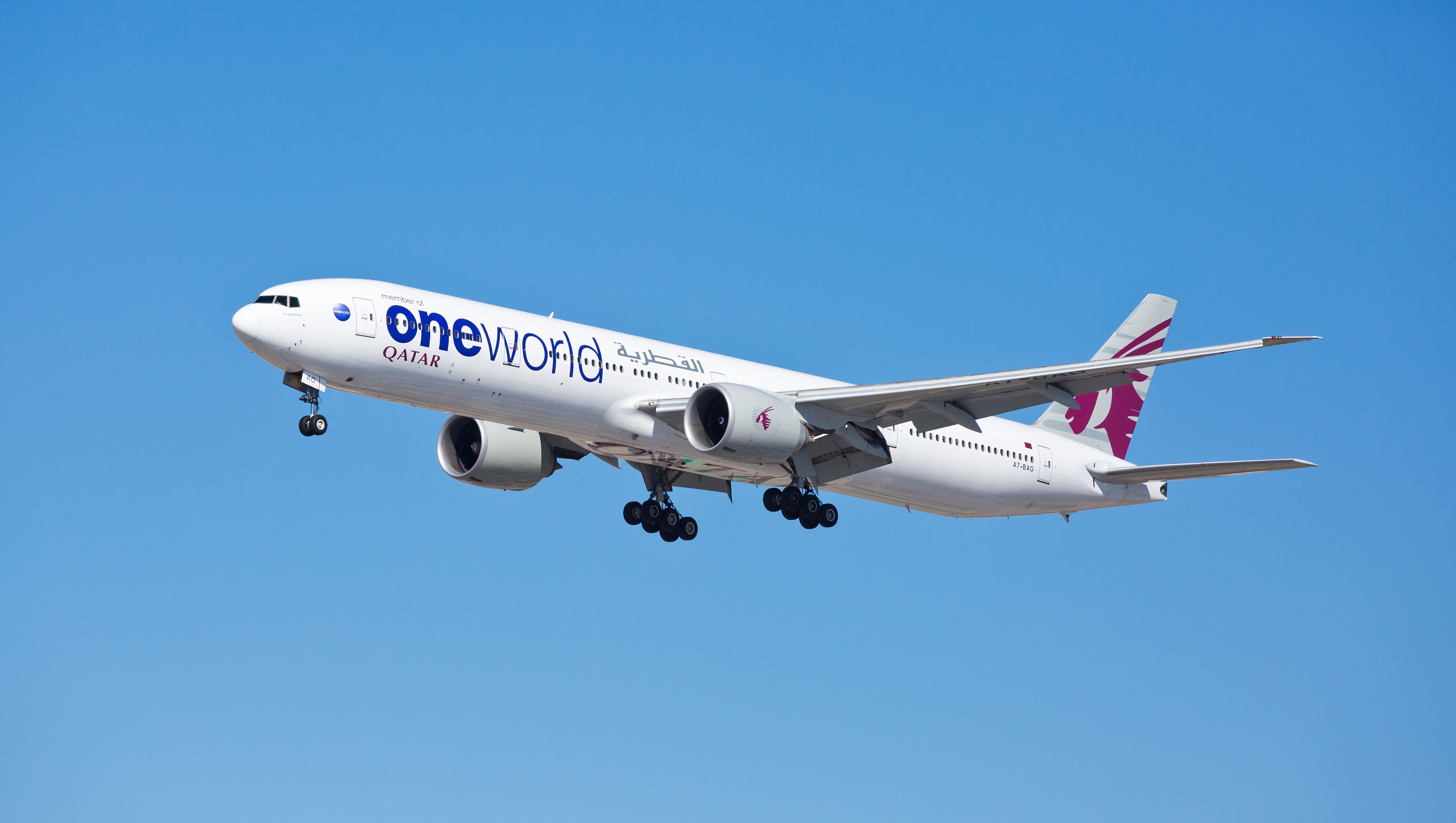 Qatar Airways OneWorld Boeing 777-300ER Landing Shutterstock_1049771606