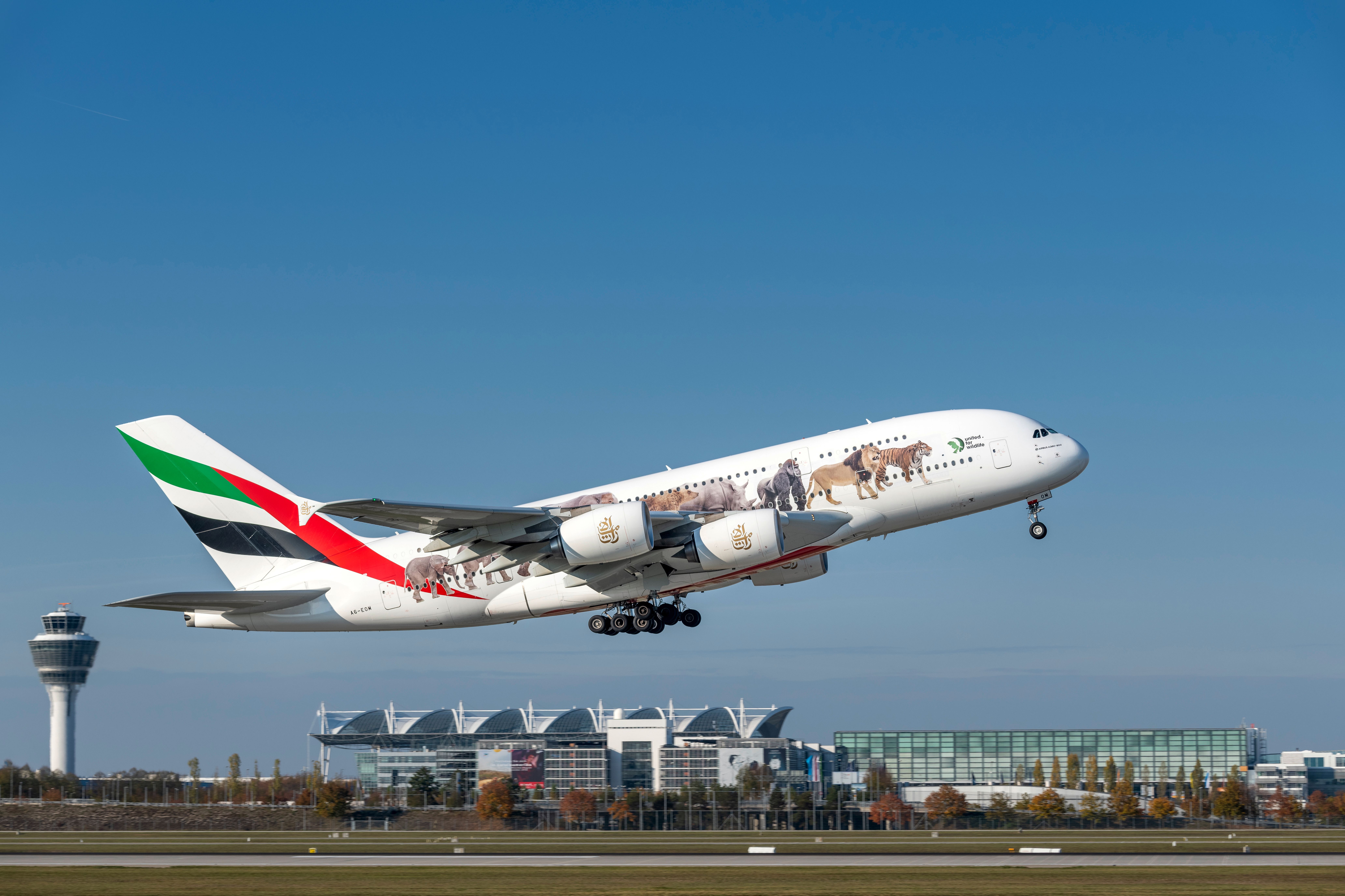 Emirates Airbus A380-861 „united for wildlife“ with the registration A6-EOM, after take-off on the southern runway of the Munich airport MUC
