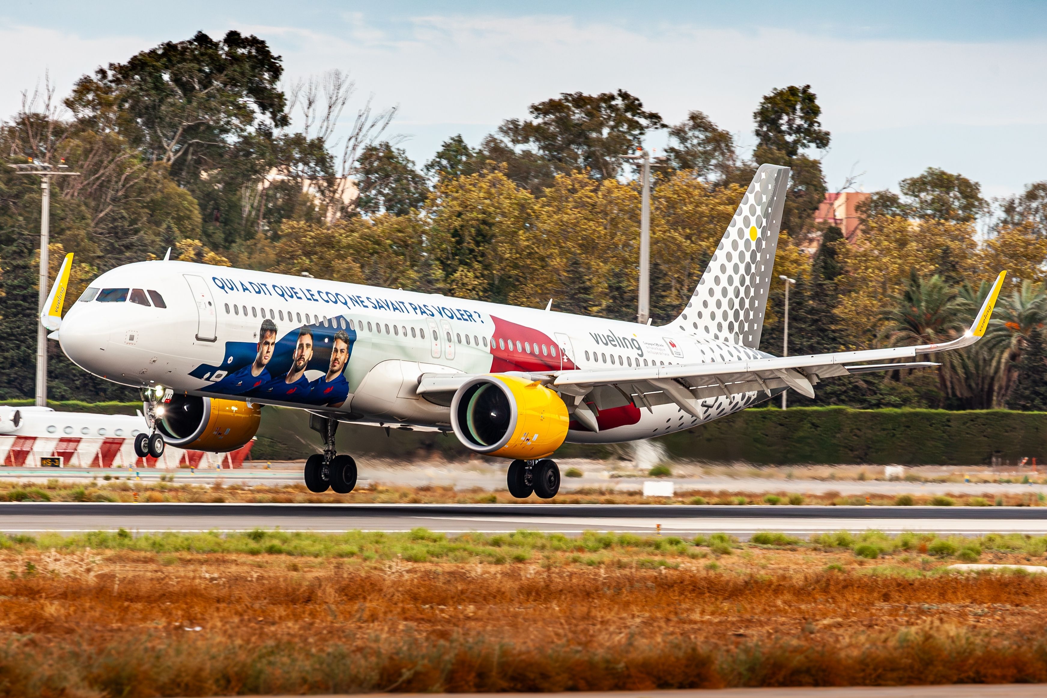 Vueling Airbus A321neo Landing at Malaga Airport AGP Shutterstock_2603079681