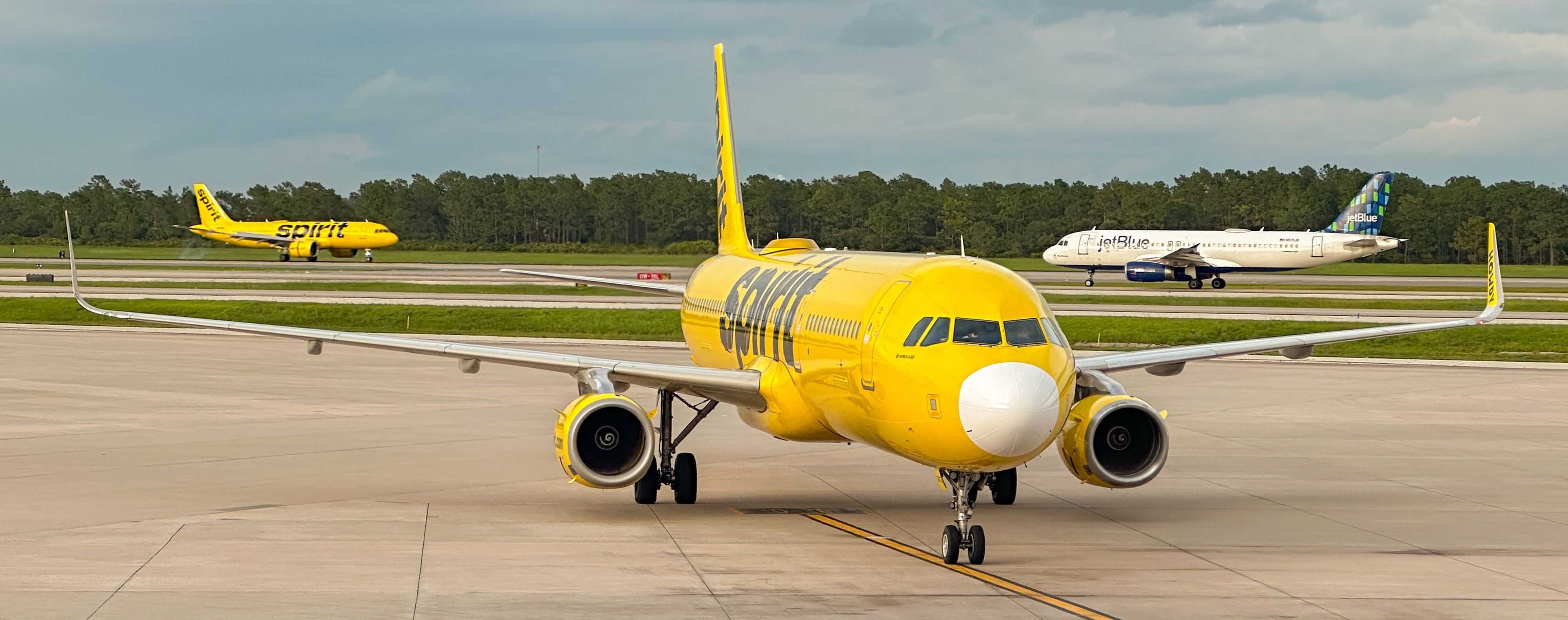 JetBlue and Spirit Airlines aircraft at MCO shutterstock_2327413327