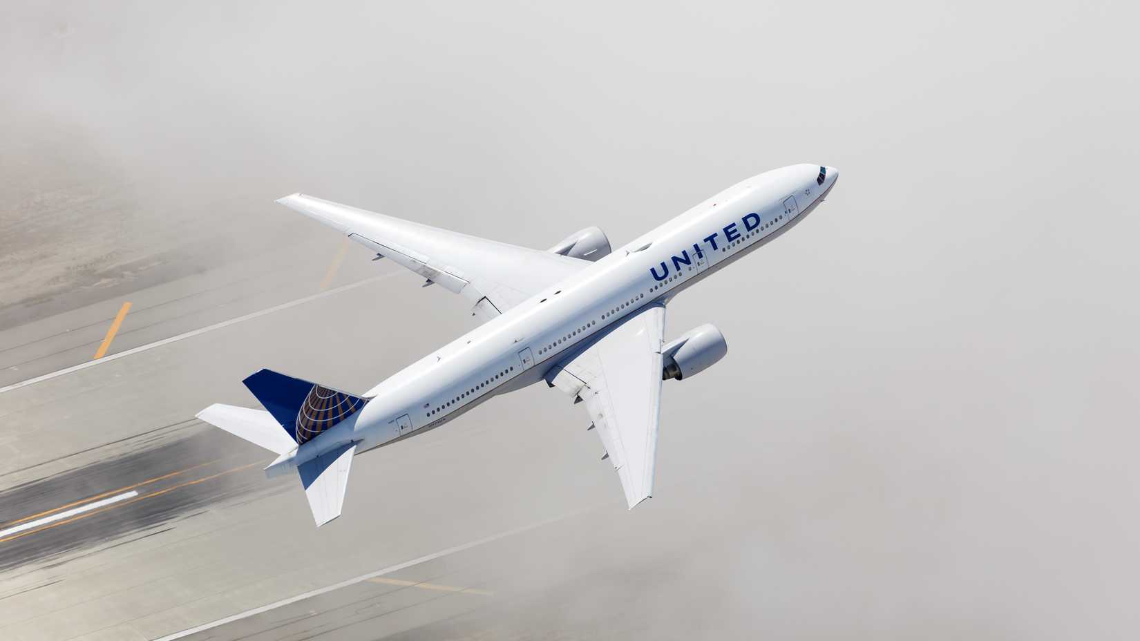 16_9, Aerial view of United Airlines Boeing 777-200 airplane at Los Angeles airport (LAX) in the United States.
