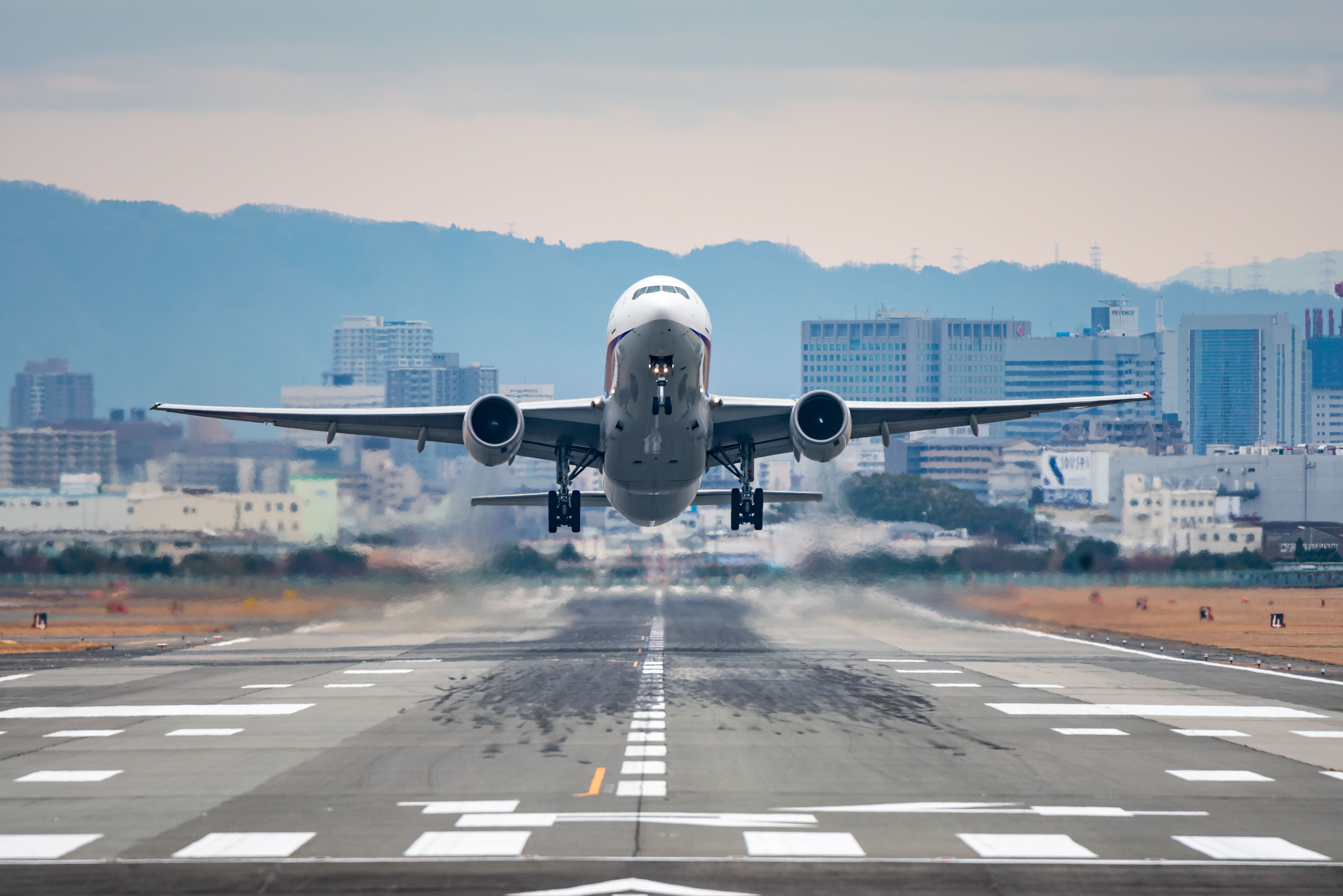 Boeing 777-200ER Tripleseven taking off from the Itami International Airport in Osaka, Japan