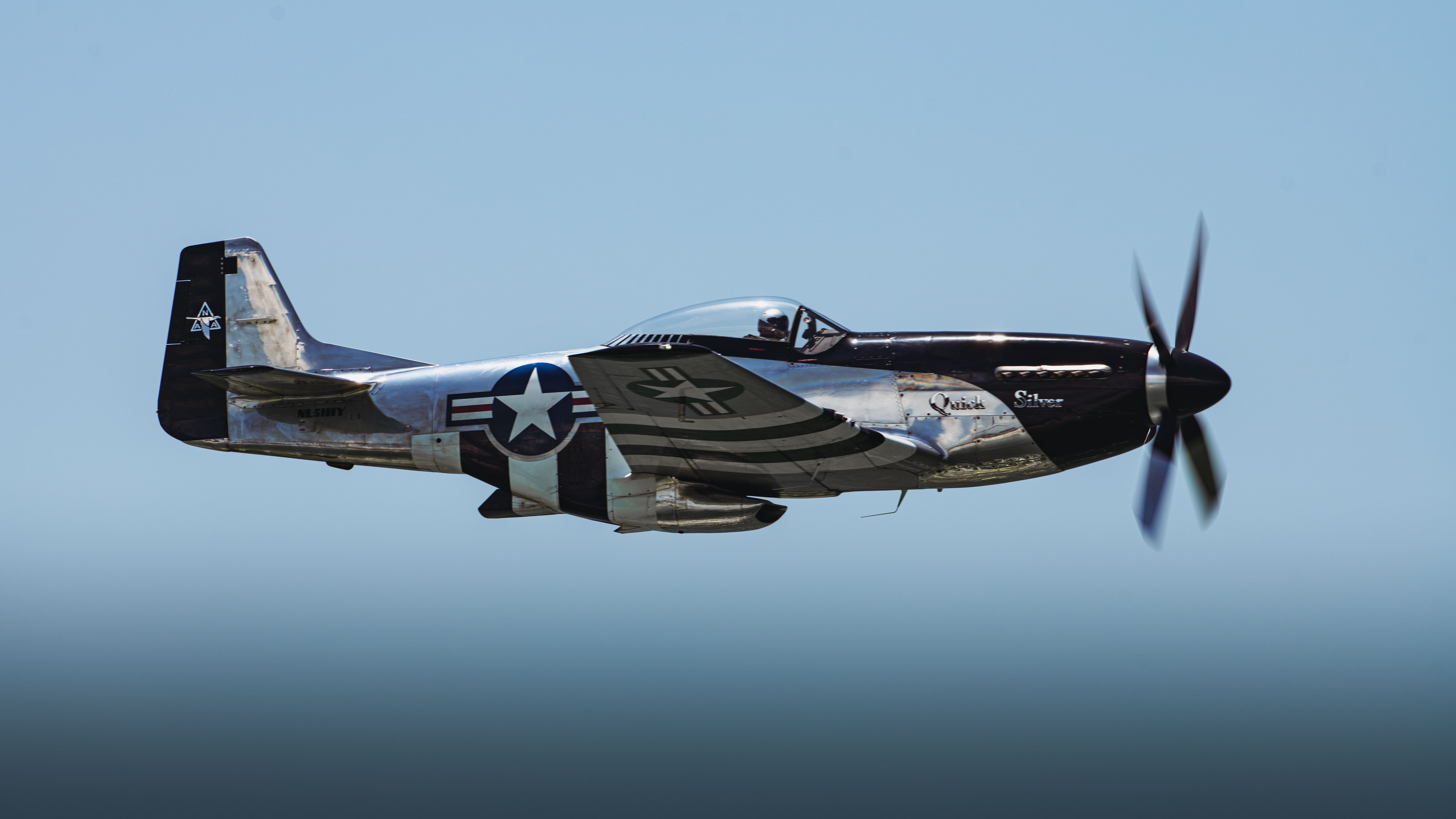 The “Quick Silver” P-51D Mustang flies over the Gulf of Mexico during the 2024 Gulf Coast Salute Air Show at Panama City Beach, Florida