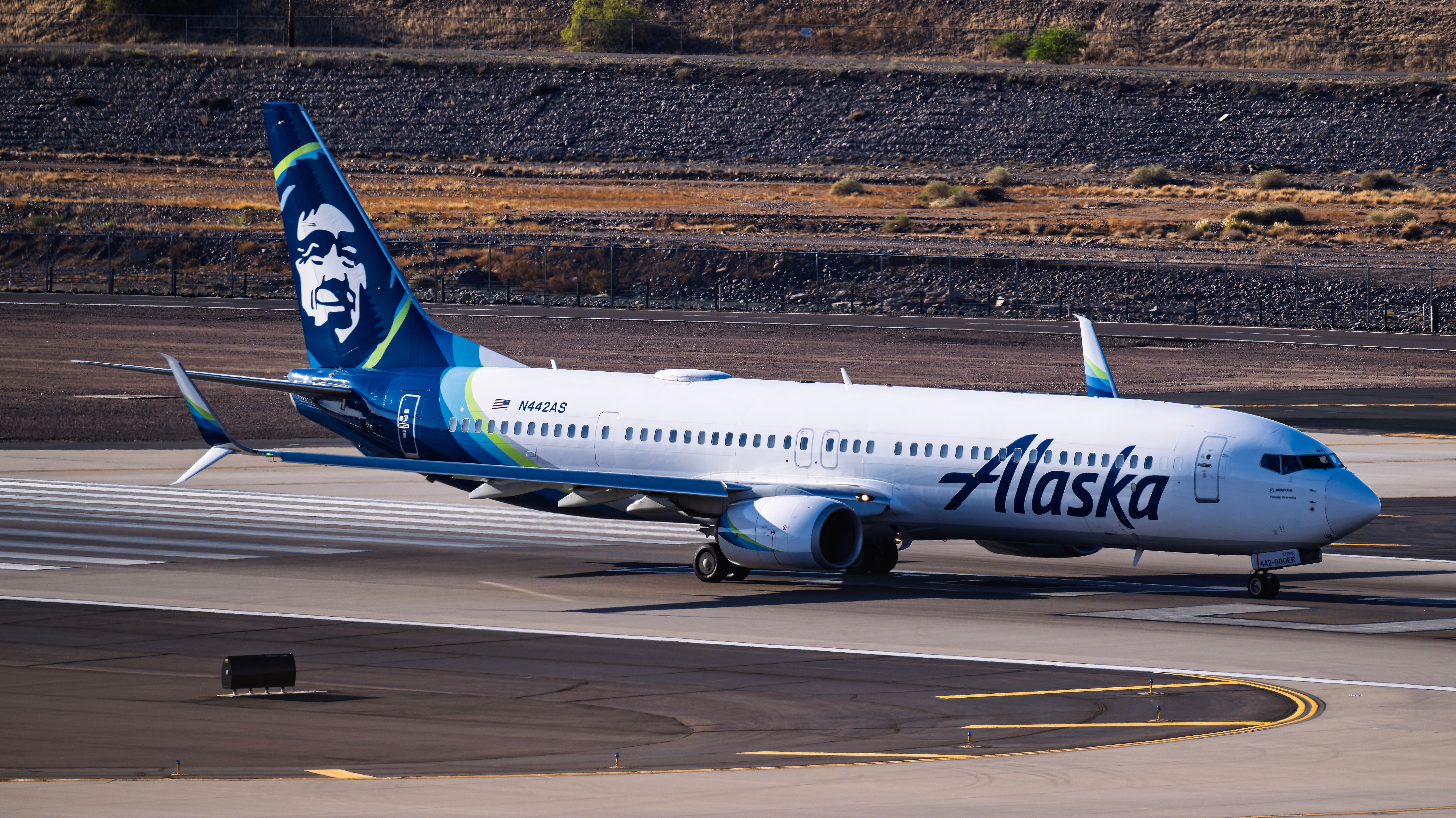 Phoenix AZ USA Alaska Airlines Boeing 737-900ER N442AS departure from Phoenix Sky Harbor Intl. Airport.