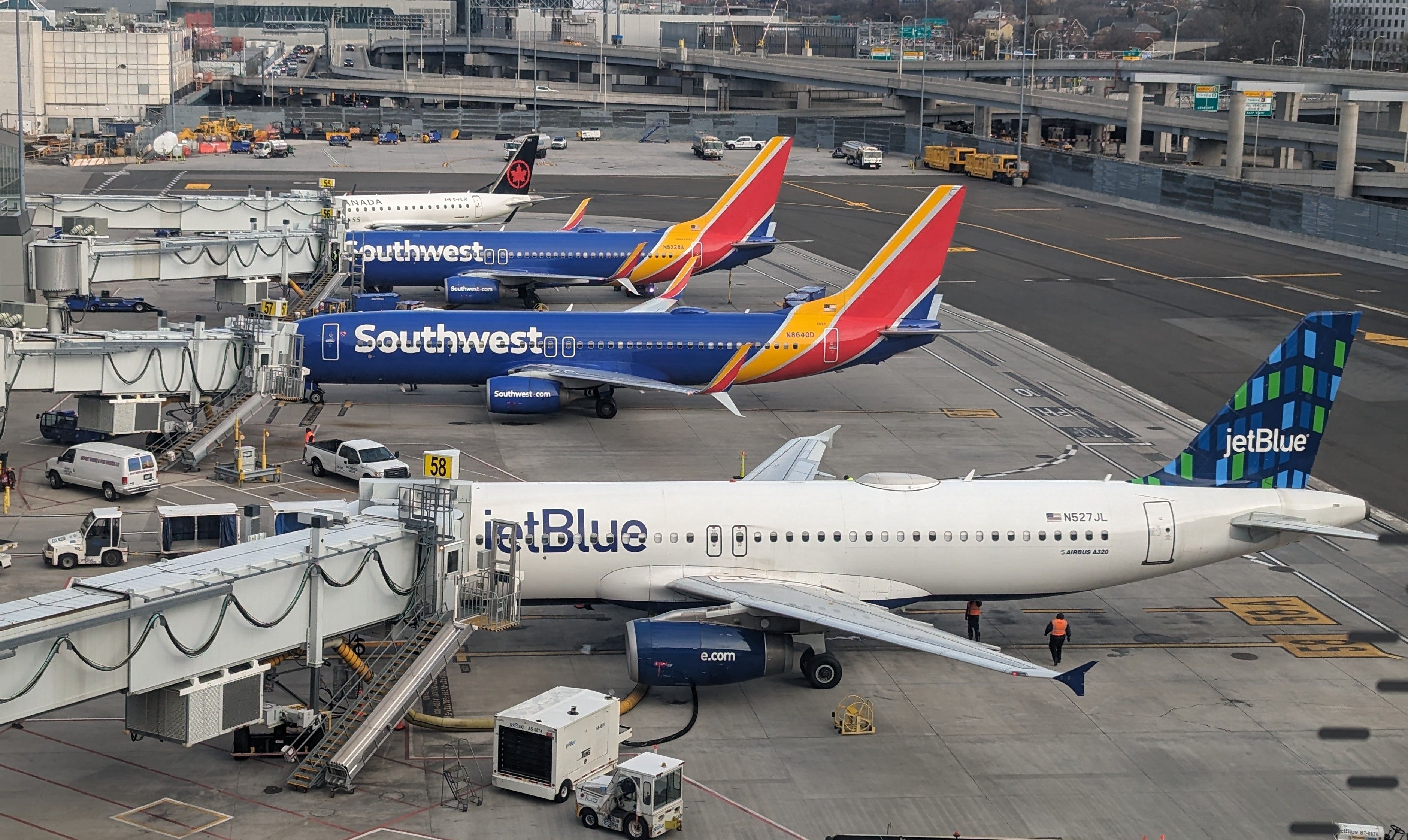 JetBlue and Southwest Airlines aircraft parked side by side