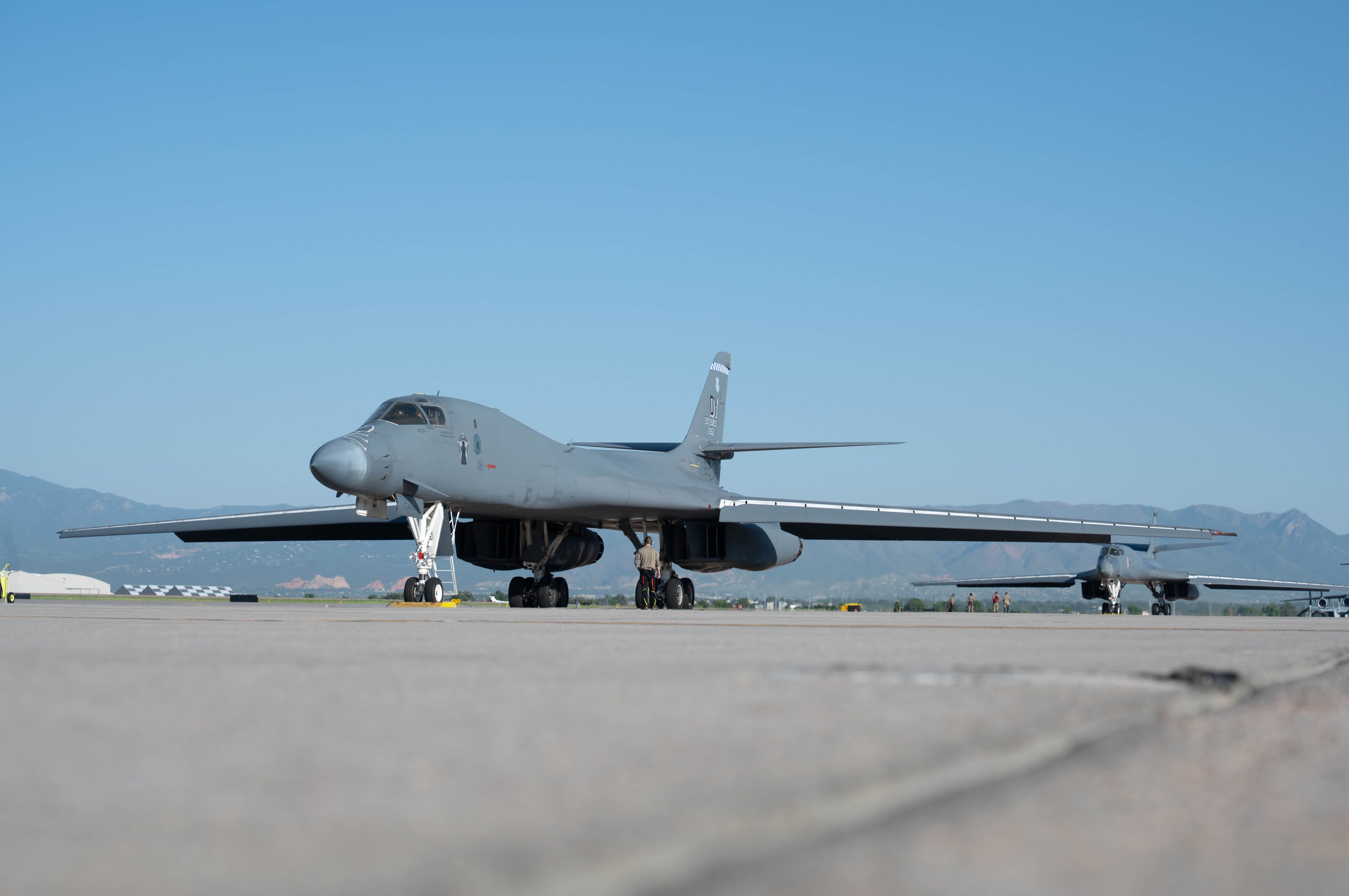 Two B-1B Lancer aircraft from Dyess Air Force Base, Texas, prepare to conduct a training exercise from Peterson Space Force Base, Colo.