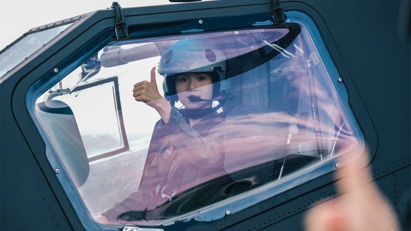 A female pilot assigned to a brigade under the Chinese PLA Army gets ready for a flight training exercise on September 10th, 2024.