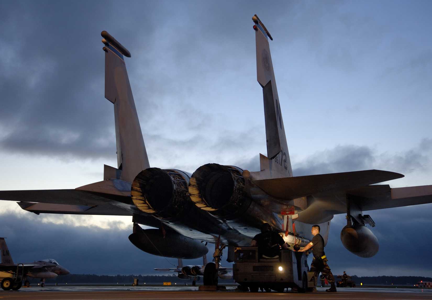 A weapons loading team attaches an AIM-7M Sparrow missile on an F-15C Eagle aircraft at Tyndall Air Force Base, Fla., on May 9, 2006.
