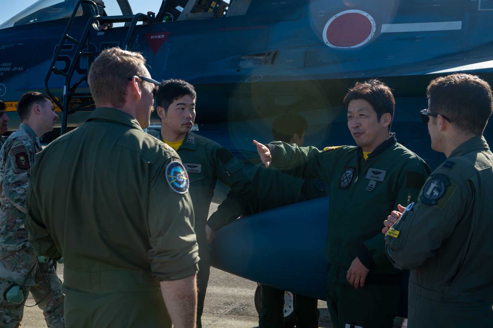 Air Force Airmen assigned to the 388th Fighter Wing Hill Air Force Base, Utah, currently deployed to Kadena Air Base, Japan, participate in an aircraft brief from Japan Air Self-Defense Force pilots on the F-2.