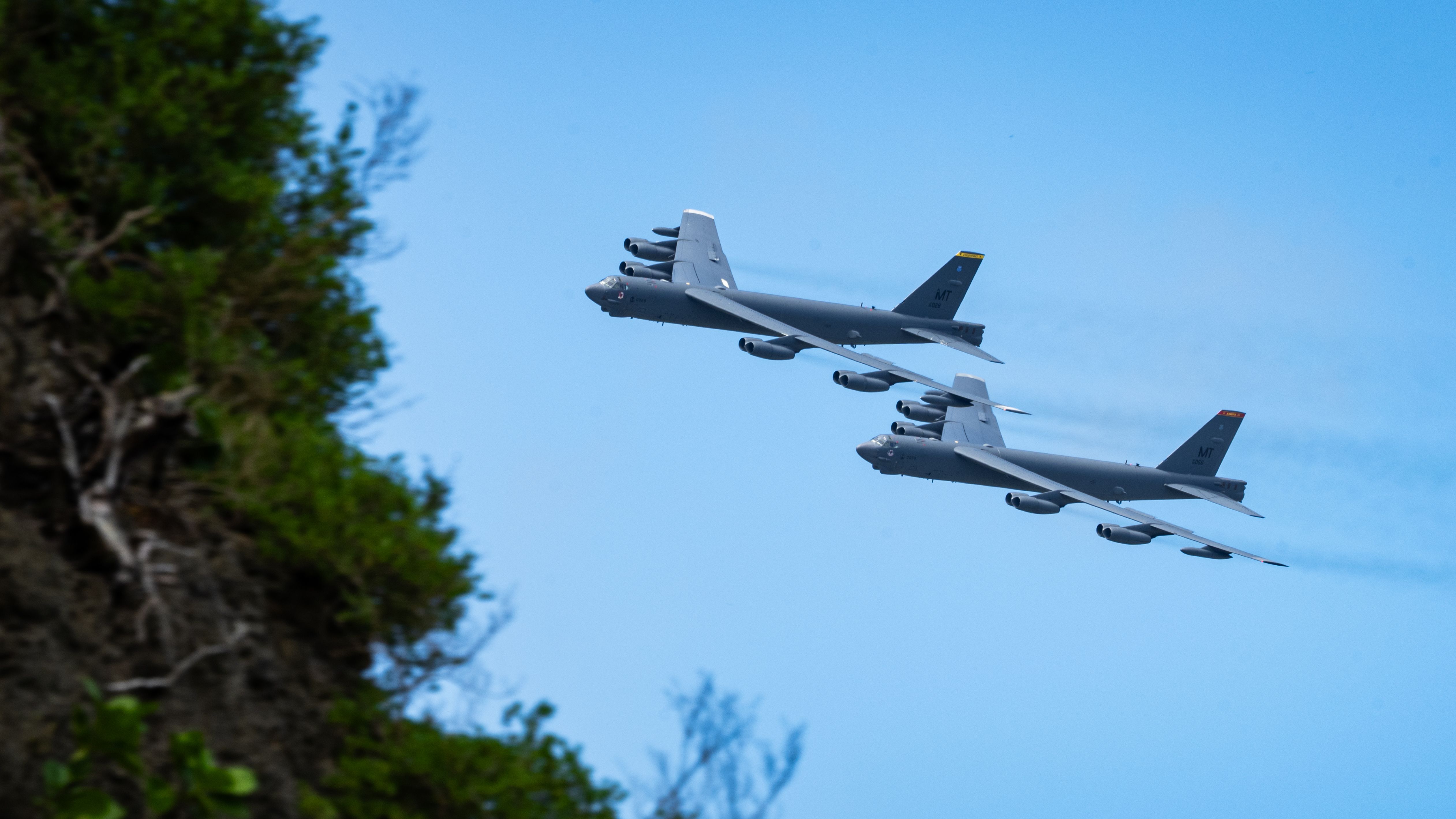 Air Force B-52H Stratofortress aircraft fly by the 81st Liberation Day Parade, leveraging a training sortie during the U.S. Air Force's 2025 Department-Level Exercise series.