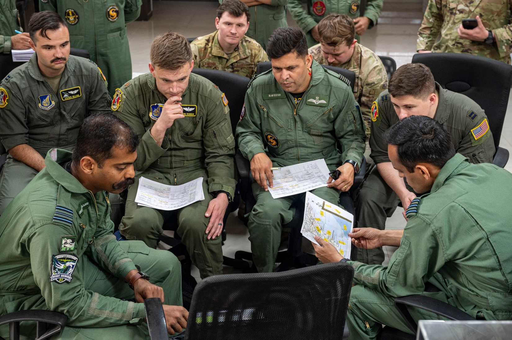 Air Force pilots assigned to the 36th Airlift Squadron plan military free fall training alongside members from the Indian air force at Visakhapatnam, Andhra Pradesh, India, April 3, 2025.