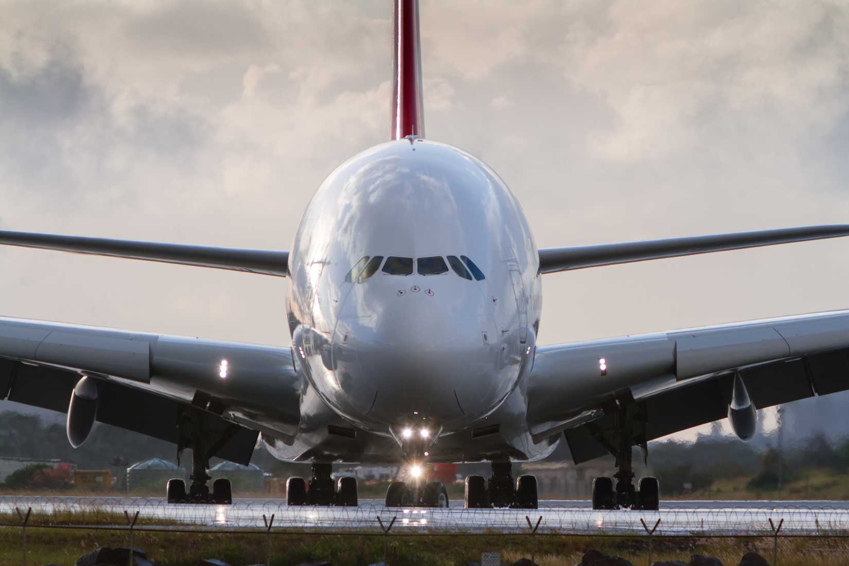 Airbus A380 jumbo airliner in front view on runway
