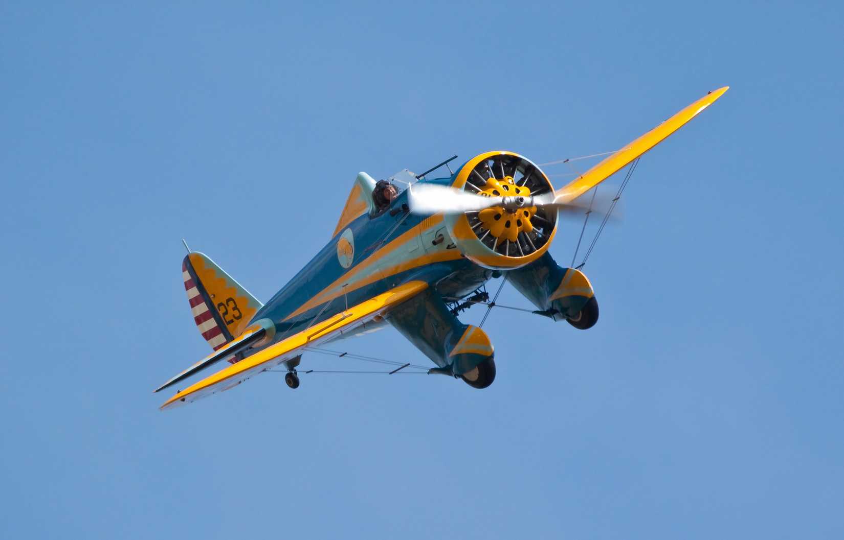  Boeing P-26A Peashooter (33-123) flying on July 12, 2014 at the Duxford Legends Air Display in Duxford, Cambridgeshire, UK.