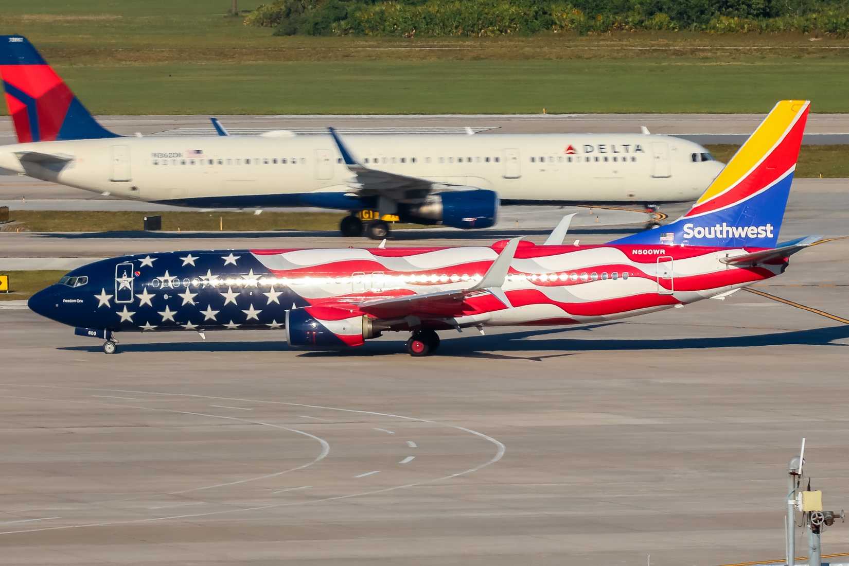 Southwest Airlines Boeing 737 and Delta Air Lines aircraft in the background 