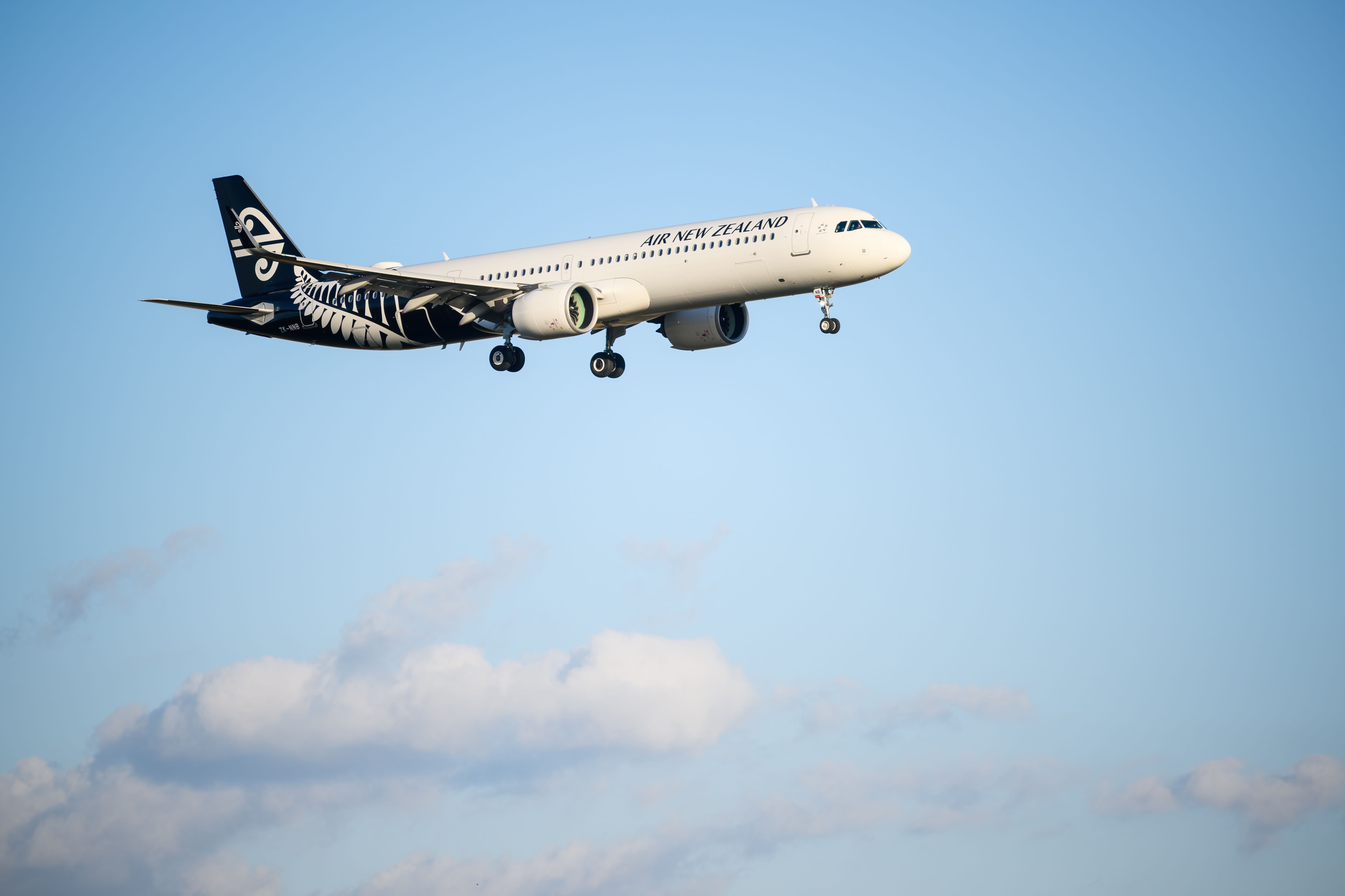 Auckland, New Zealand – March 05 2025: Air New Zealand ZK-NNB Airbus A321-271NX flying towards Auckland International Airport.